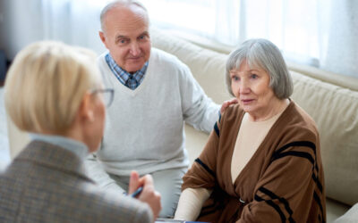 Anonymous therapist having meeting with elderly patients in nurs